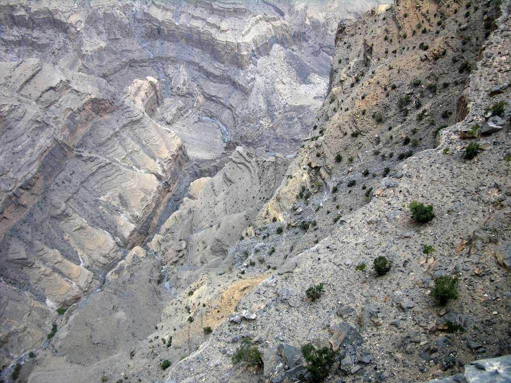 Muscat 07 11 Jebel Shams Canyon Looking Down Jebel Shams is the second deepest canyon in the world after the Grand Canyon in the USA. We walked to the canyon rim and stared over the 2km vertical drop to the bottom of the canyon.